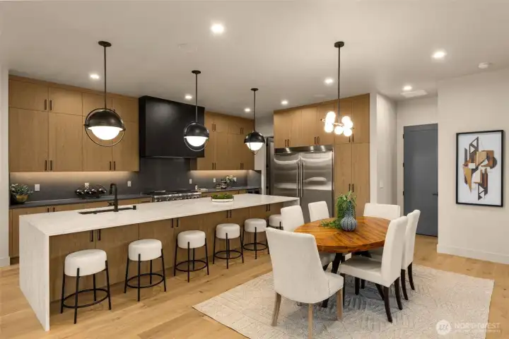 Chef's kitchen with extended island and custom, real wood cabinetry