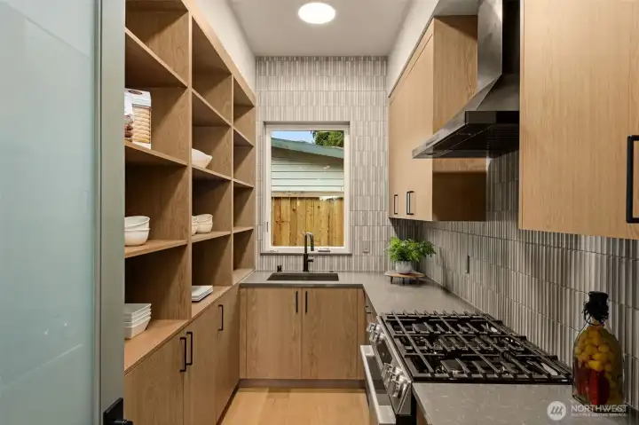 Prep kitchen with oven, dishwasher and sink