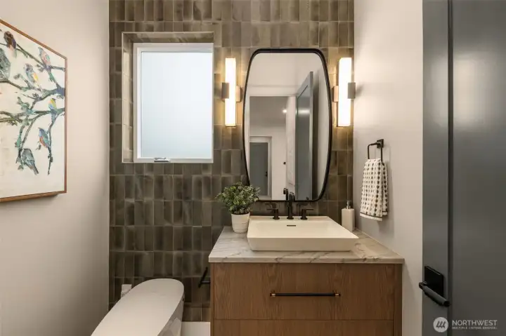 Designer powder room with accent tile wall