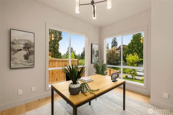 Main level office with floor to ceiling windows