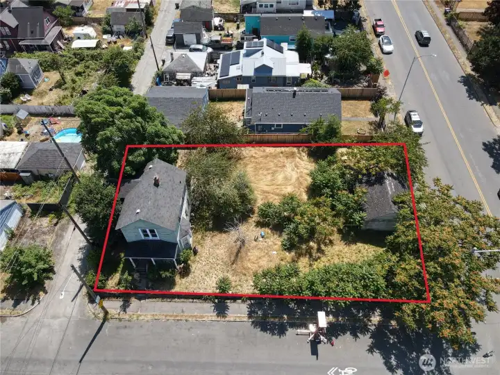 Home is built off the alley. Home sits on 50 x 120 sq ft lot. Outbuilding in picture. Vacant lot is 25 x 120 SQ FT. Home is built off the alley. Home sits on 50 x 120 sq ft lot. Outbuilding in picture. Vacant lot is 25 x 120 SQ FT.