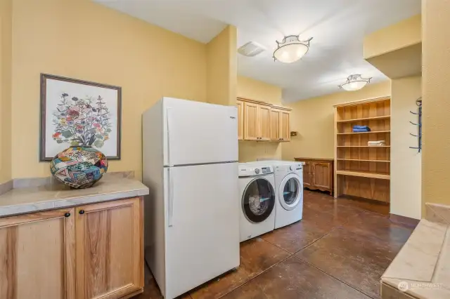 Giant utility room with laundry chute directly from Primary Bedroom.