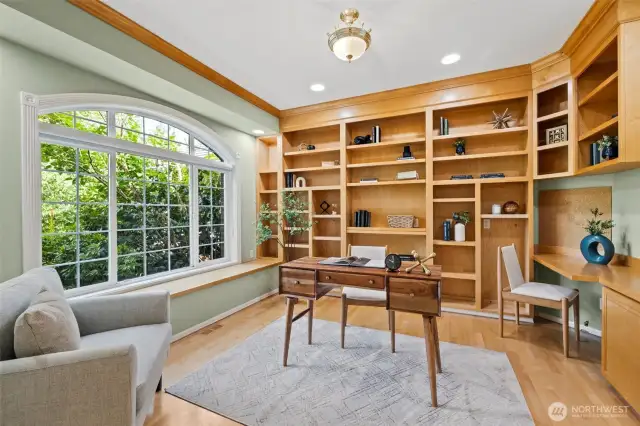 Here is the office with beautiful built-ins and hardwood floors.
