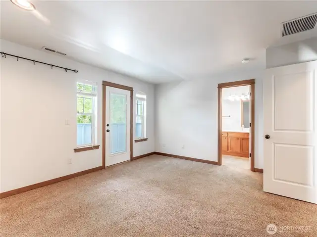 Spacious Primary Bedroom leading out to covered balcony