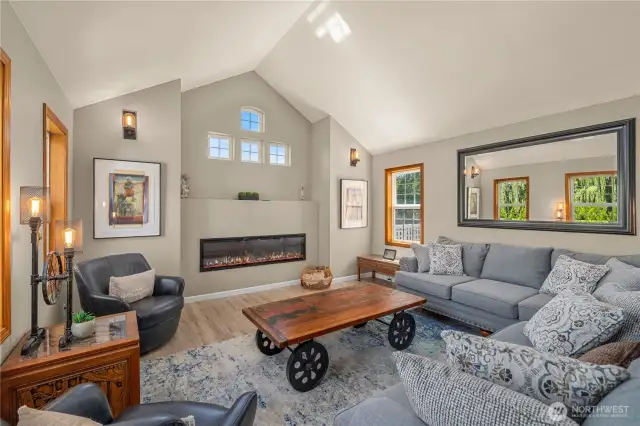 Cozy up in this comfortable living room with state of the art electric fireplace