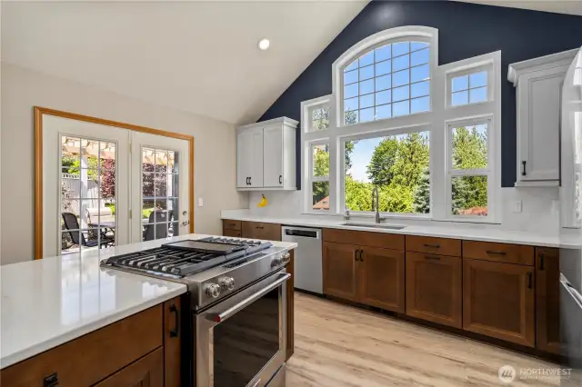 The view from the vaulted kitchen windows brings the outside inside