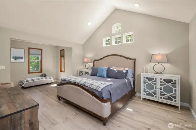 Primary suite on the main level with high vaulted ceiling