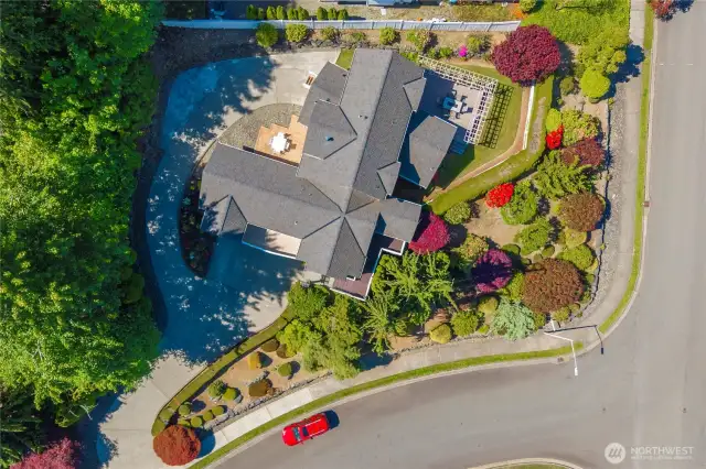 This aerial view shows the newer 50 year architectural roof installed in 2021