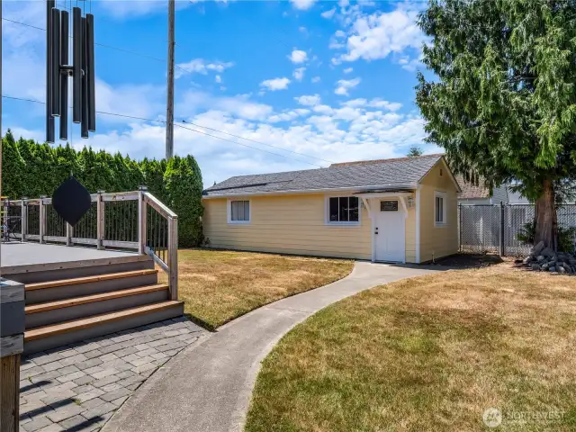 Walk-way to the detached garage which is accessed through the alley.