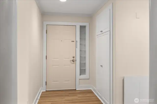 Entry into condo with storage on right.