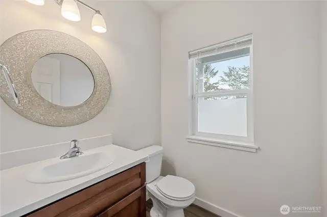 Downstairs powder room at entry