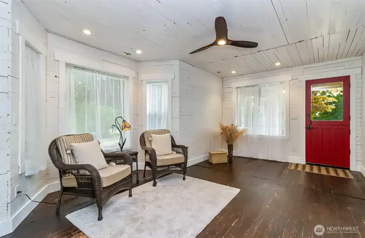 Step back in time to the original floors & walls in the living room. Nice & bright updated bay windows too.