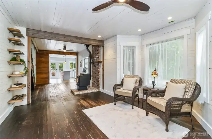 Another look at the living room and into the dining area.  Check out the natural wood beams, new pellet stove, and the character that speaks to you as you enter.