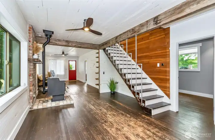 Dining area and stairway to second level.  Very creative handrailing on the stairs!