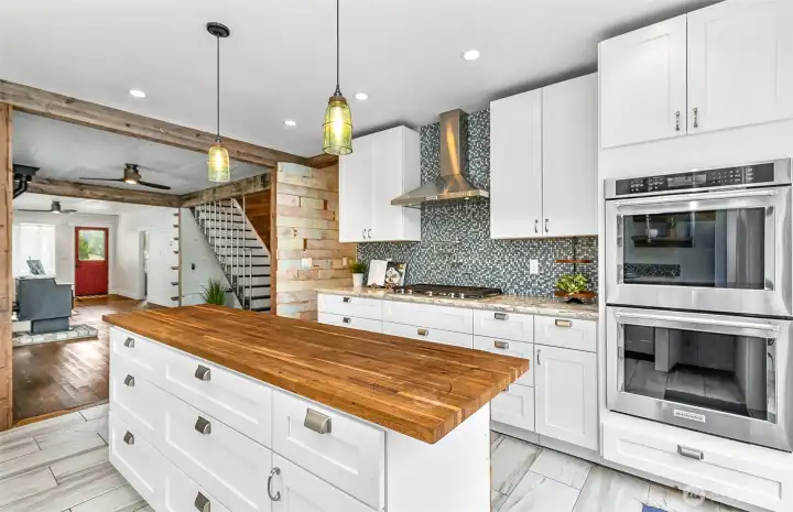 So open & inviting to prepare your meals! 5 burner gas stove, double oven, all updated for convenient cooking & entertaining!