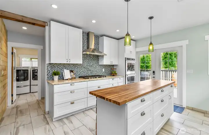 Kitchen flows into a large pantry area and the mud/laundry room.