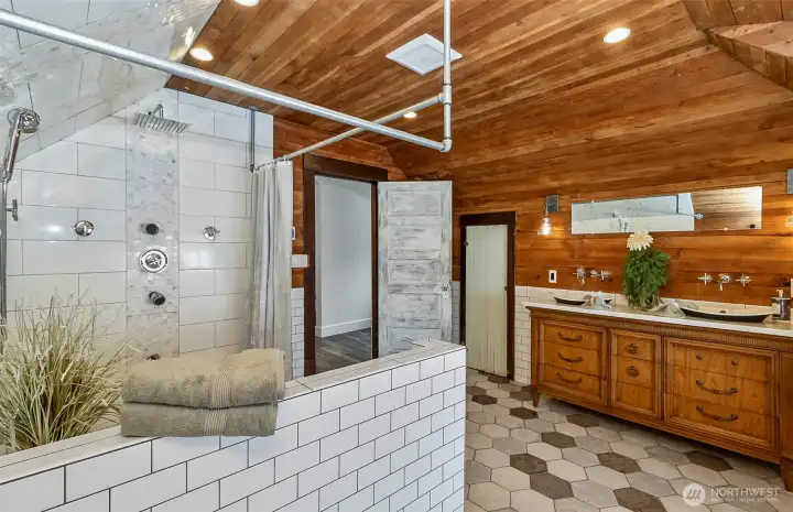 The shower in the primary bath is HUGE, very spa like, and one you could spend hours in!