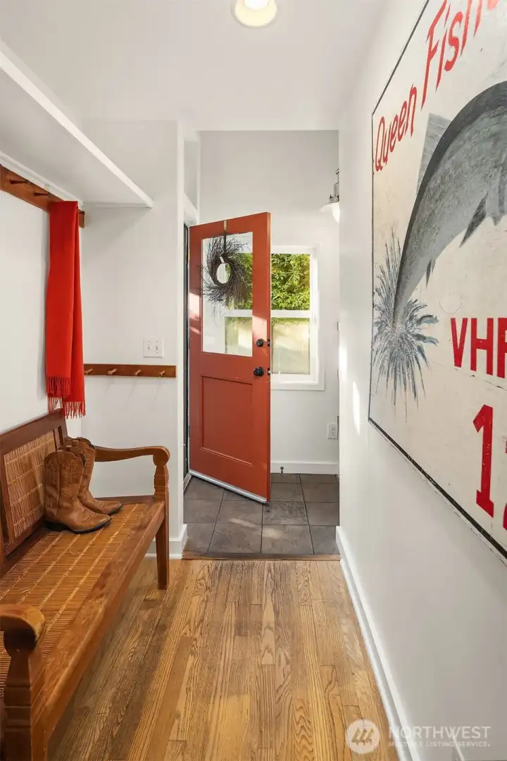 An entry that welcomes you home. From the covered front porch to the mud room with shelving and an alcove for a bench, shoes, and coats.