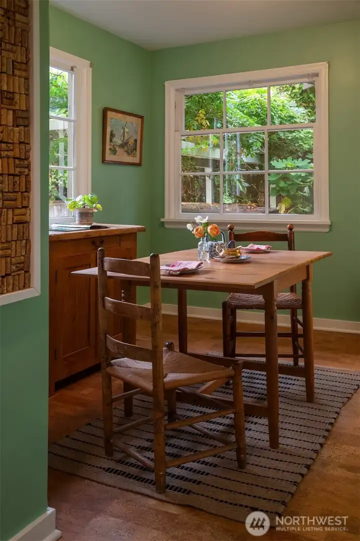 A perfectly lovely breakfast nook off the kitchen with two large pantries on each wall. The perfect place to welcome the day.