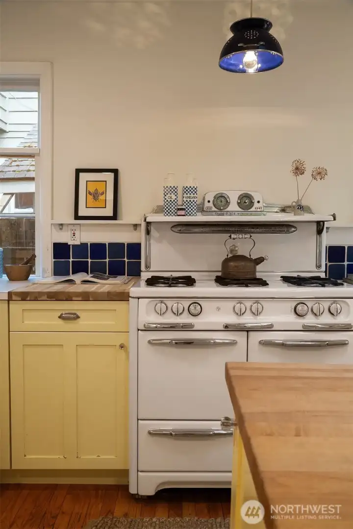 Built in wine racks, spice racks, and the perfect division between kitchen and dining.  Enough to hide a mess but open for conversation.