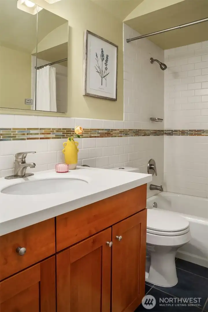 The full bath opens up the possibility of a main floor primary bedroom or a perfect guest space.