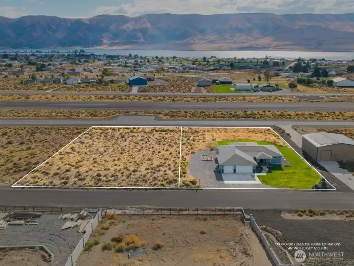Land in back of the house goes almost to the runway - plus the 1/2 acre lot to the left = All yours!