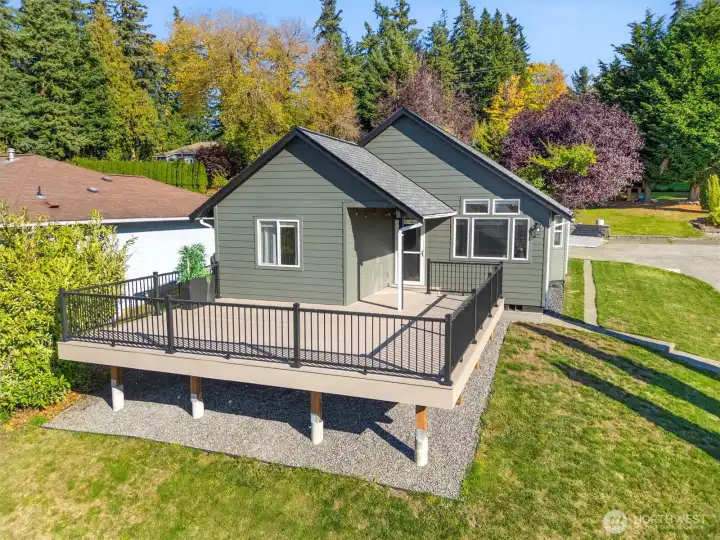 The front exterior showcasing the home’s inviting curb appeal and spacious wraparound porch.