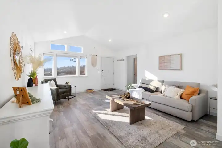 Stylish living area with modern flooring and recessed lighting.