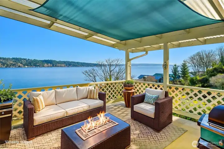 Wow, just look at the view from this spacious covered deck! Imagine gorgeous sunrises from this spot! Virtually staged.