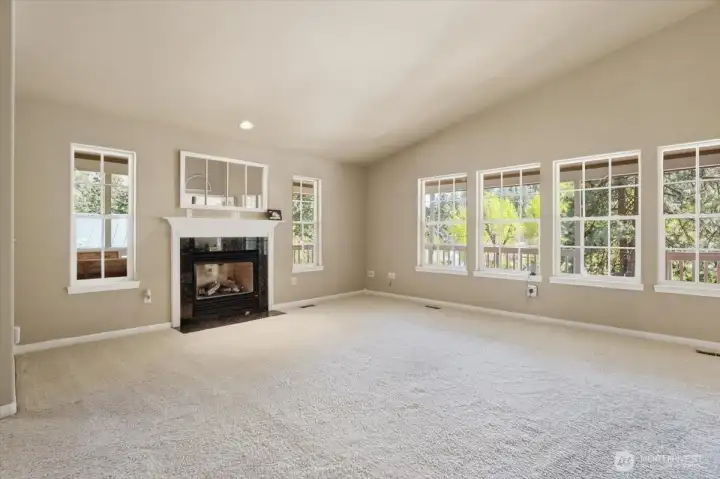 Living room with lots of windows for a light & bright home.