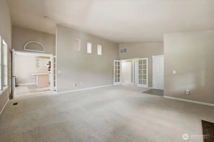 Living room looking towards the kitchen & dining room to the left and bedroom area to the right.