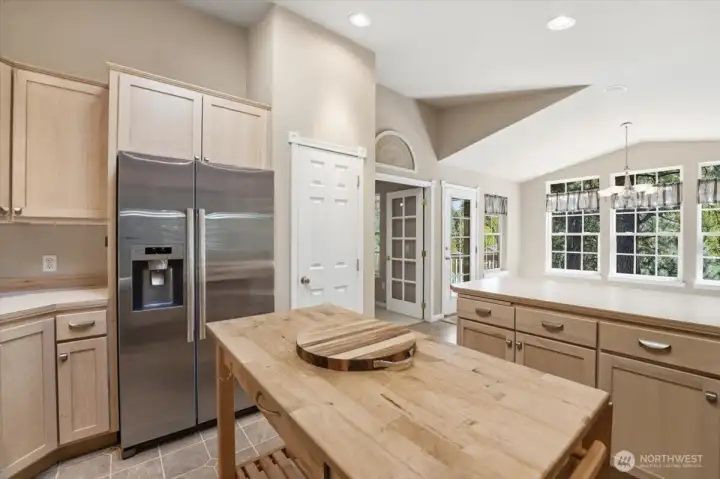 Refrigerator is included in sale. Door is to the kitchen pantry.