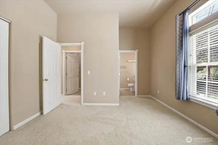 Primary bedroom looking into the primary bathroom.