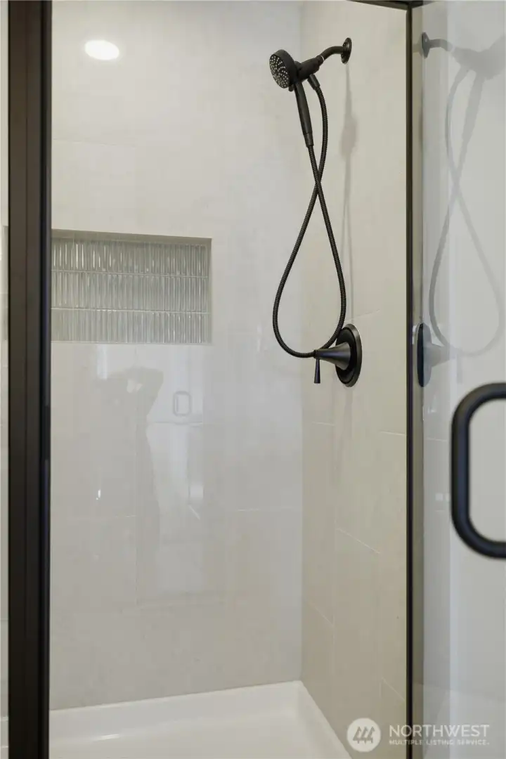 Tile shower with glass enclosure and contemporary design