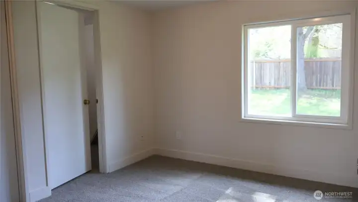 Welcome to the primary bedroom! Brand new flooring and paint.
