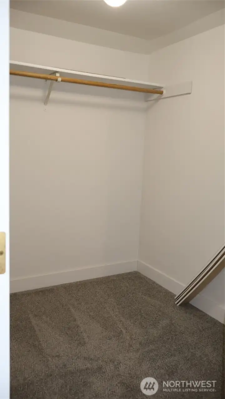 Spacious walk-in closet off the primary suite.