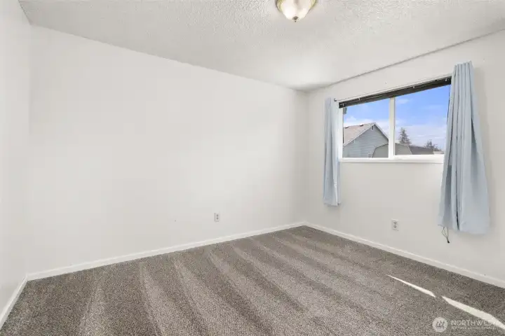 Bedroom 1, with new paint, new trim and new carpet.