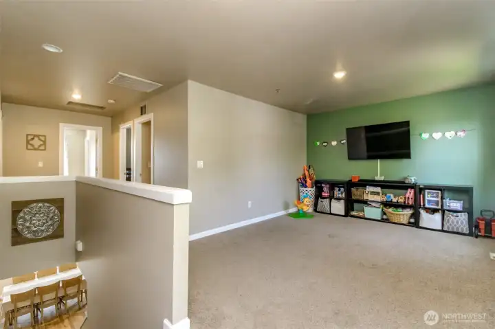 Large Upstairs bonus room!  Perfect for theater room, school room, or having the neighborhood kids over or ? This room is so large you could probably fit a long arm quilting machine!