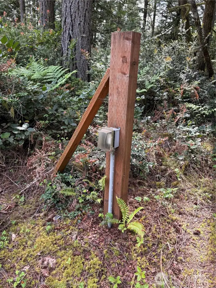Underground electrical conduit has been run to the property and stubbed out at a treated-wood post near the second proposed RV site, complete with a weatherproof junction box.