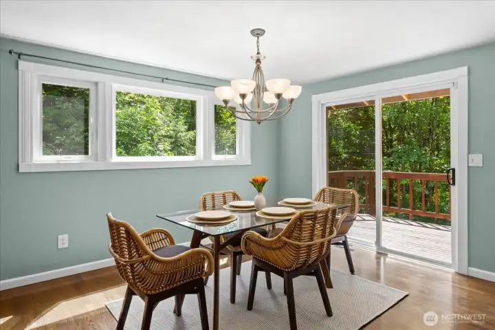 Adjoining dining room with doors to the deck.