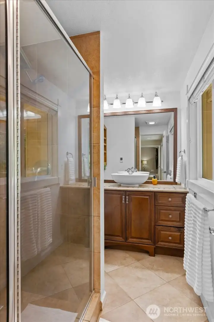 Walk-in shower in primary bath.