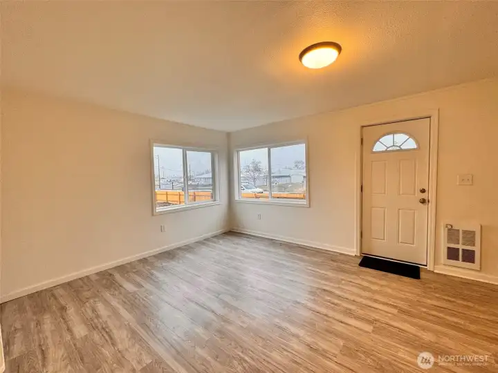 Welcome home! Step into the inviting living room, filled with warmth and natural light.