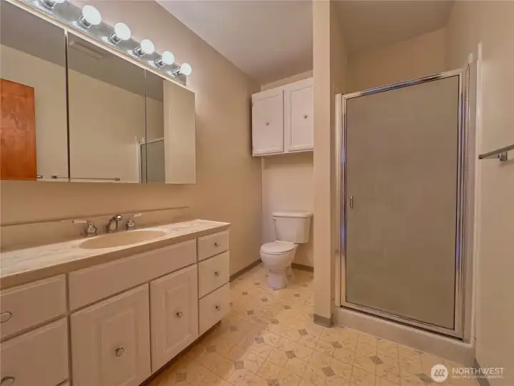 Three quarter bathroom off primary bedroom.