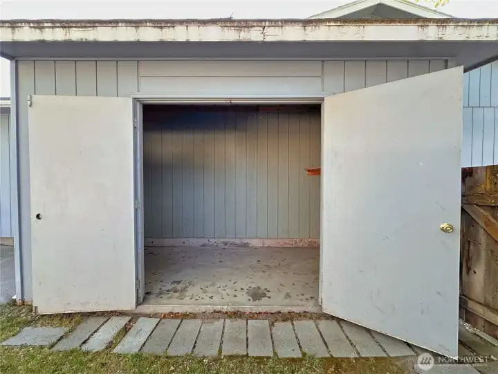 And there's an attached outbuilding for your yard care equipment.