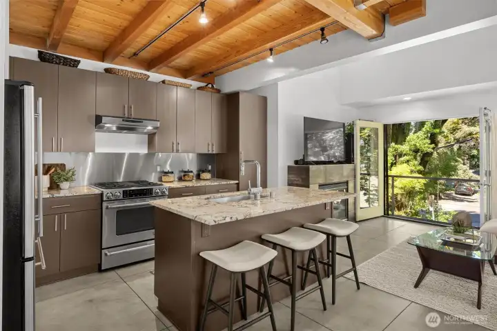 Designer kitchen with granite surfaces, stainless appliances, and exceptional workspaces. Designer kitchen with granite surfaces, stainless appliances, and exceptional workspaces.