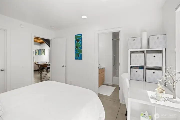 Versatile main-level en-suite bedroom ideal for guests, work-from-home needs, or additional living space. Versatile main-level en-suite bedroom ideal for guests, work-from-home needs, or additional living space.