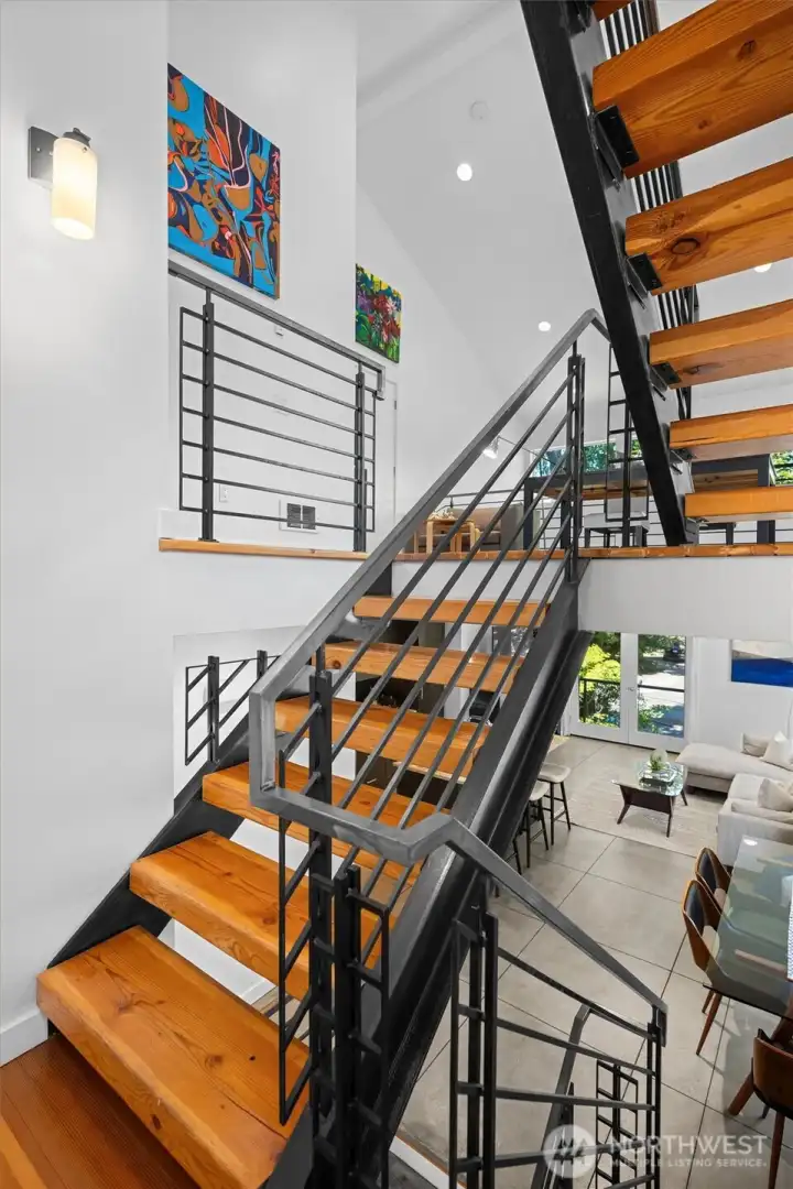 Architectural staircase and soaring ceilings create a striking first impression. Architectural staircase and soaring ceilings create a striking first impression.