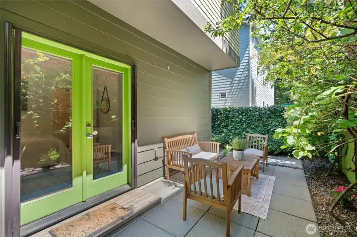 Private outdoor patio surrounded by mature landscaping, perfect for dining or relaxing. Private outdoor patio surrounded by mature landscaping, perfect for dining or relaxing.