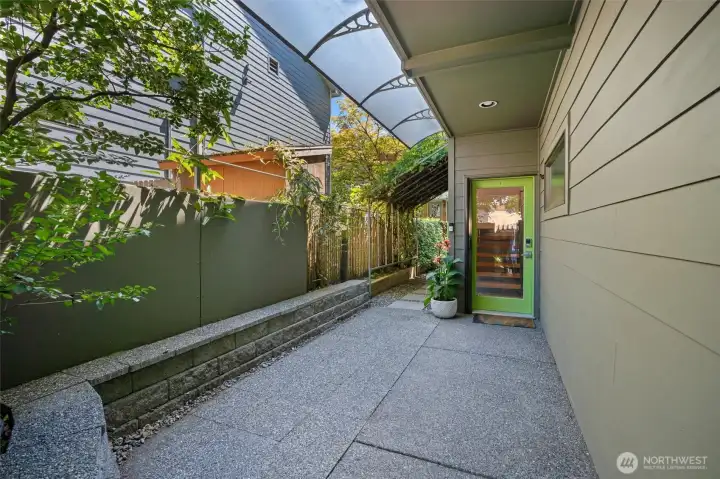Private approach framed by mature landscaping and contemporary design. Private approach framed by mature landscaping and contemporary design.