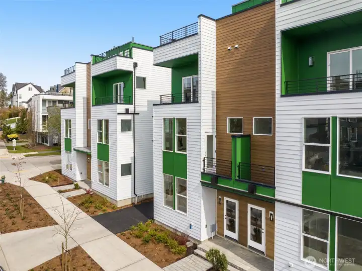Striking modern exterior featuring clean architectural lines and vibrant curb appeal. (photos are of model home, same community similar finishes)